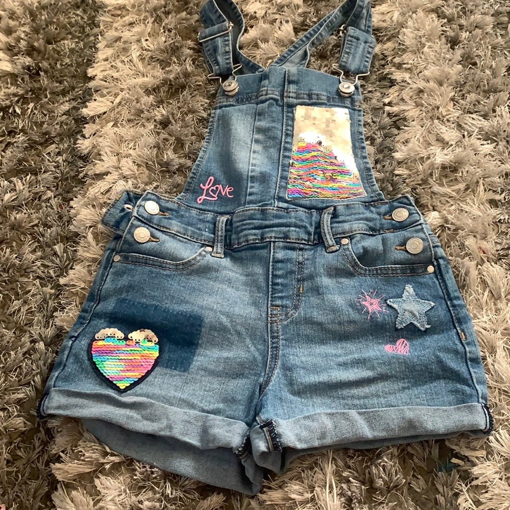 Jean overalls with sequin appliqué.